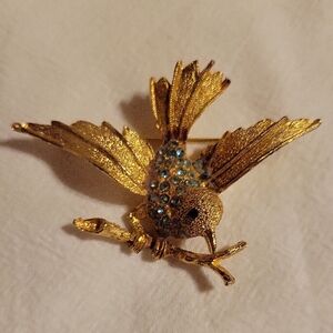 Charming Gold Bird Brooch with Blue Gems